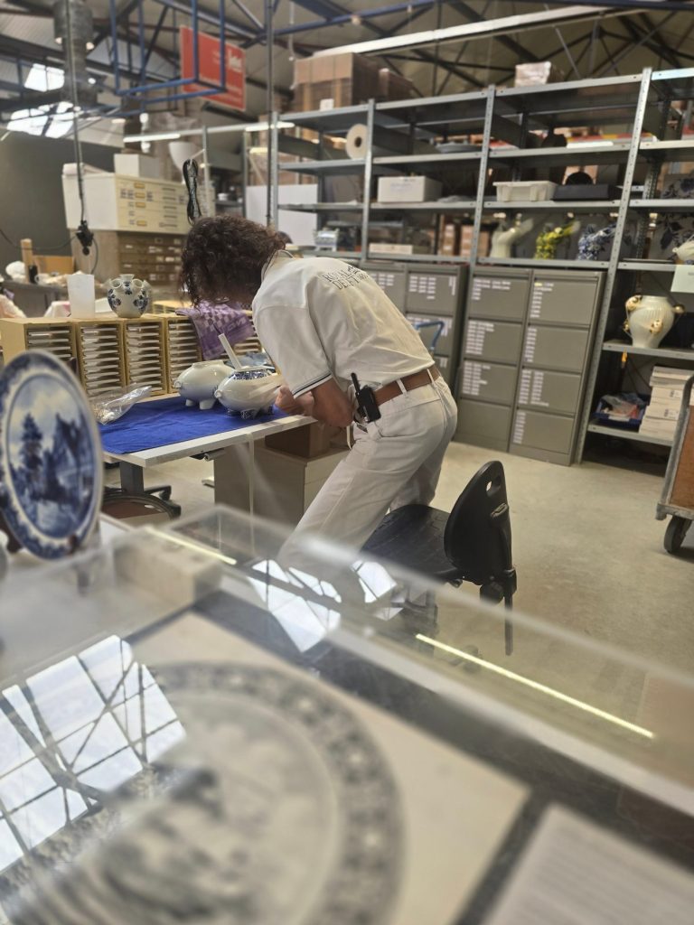 A painter at work at Royal Delft